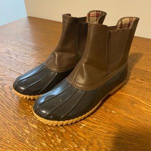 Brown and black duck boots